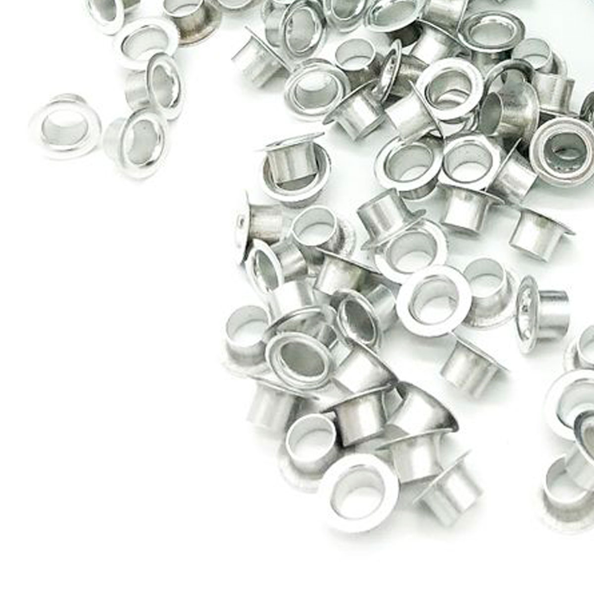DUO Ösen Nr. 535 für DUO N3 und HANG PunchNbind Silberfarbene DUO Ösen Nr. 535 aus Aluminium, lose verteilt mit sichtbaren runden Öffnungen und flachen Rändern.